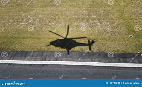 Shadow of Helicopter Flying Over Yellow Grass Stock Image - Image of ...