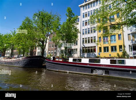 Floating houses in Amsterdam, Netherlands Stock Photo - Alamy