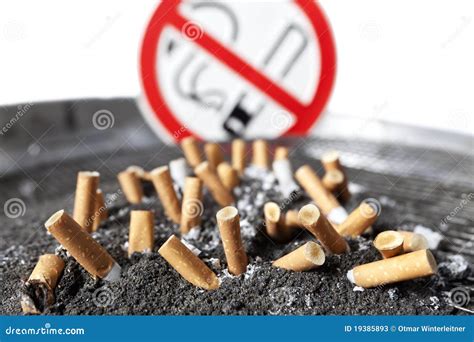 Cigarette Stubs In Ash With No Smoking Sign. Stock Photos - Image: 19385893