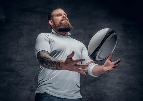 Free Photo | Portrait of bearded rugby player with tattoos on his arms