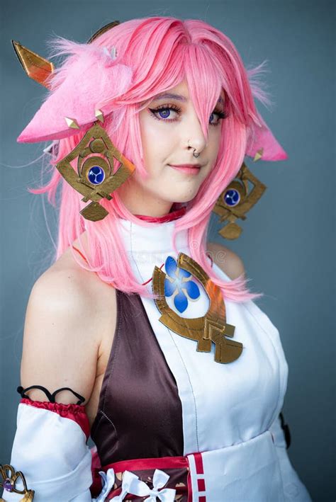 Female Cosplayer in a Pink Anime Costume Wearing Pink Hair Stock Image - Image of costume ...