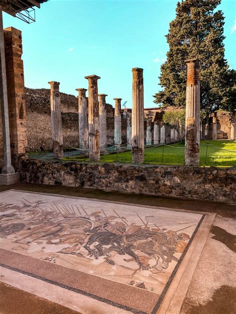 an ancient roman mosaic in the ruins of pompeii, with columns ...