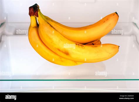 A bunch of bananas on shelf in fridge. Close up Stock Photo - Alamy