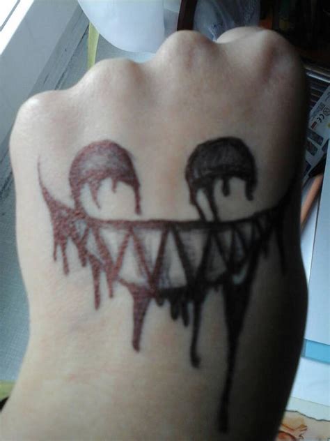 Evil smile tattoo by Najemniczkas on DeviantArt