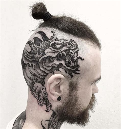 Share more than 78 dragon face tattoo latest - in.coedo.com.vn