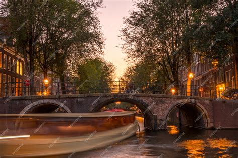 Premium Photo | Netherlands quiet sunset on the amsterdam canal ...