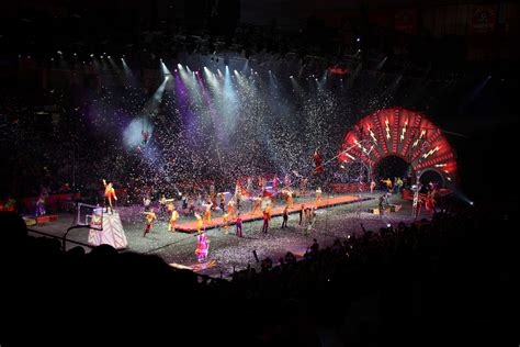 the performers are performing on stage in front of an audience