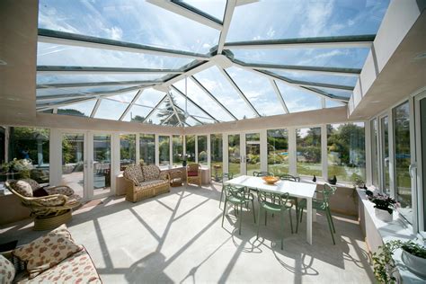 A White Ultraframe Conservatory with a Glass Roof Glass Conservatory Roof, Modern Conservatory ...