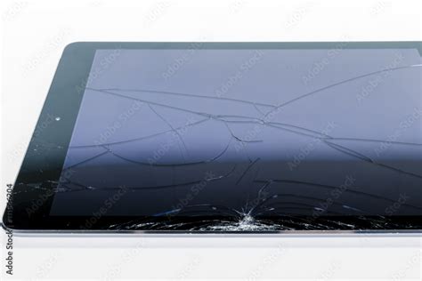 Broken iPad with a shattered glass screen on white background Stock ...