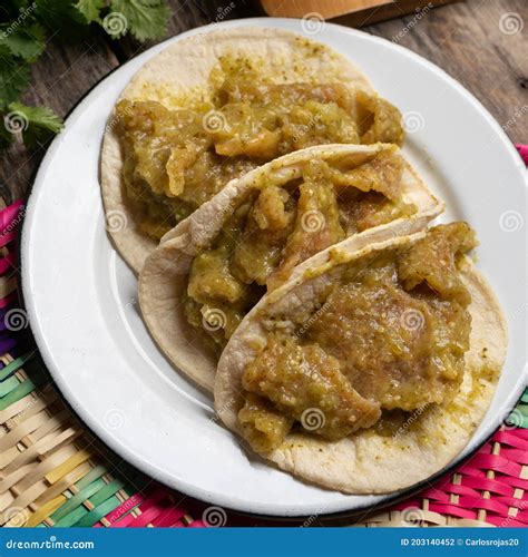 Mexican Pork Chicharron with Green Sauce Tacos on Wooden Background ...