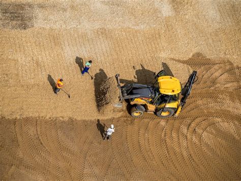 Premium Photo | Wheeled loader in action at a road construction site