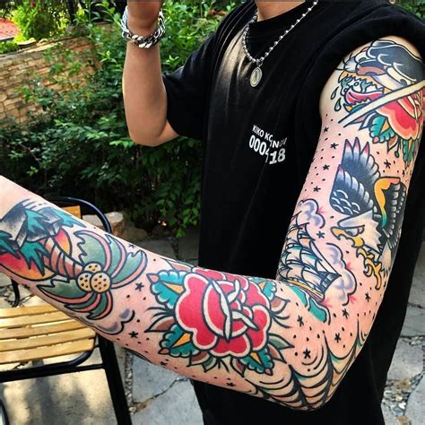 a man with tattoos on his arm and arms