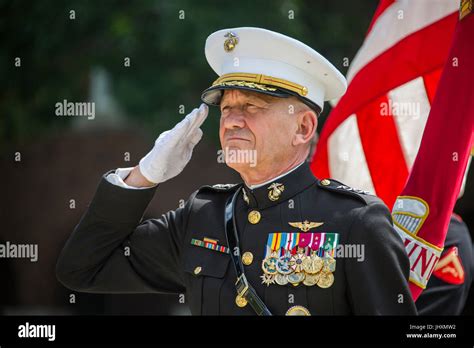 U.S. Marine Corps Aviation Deputy Commandant Jon Davis renders a salute ...