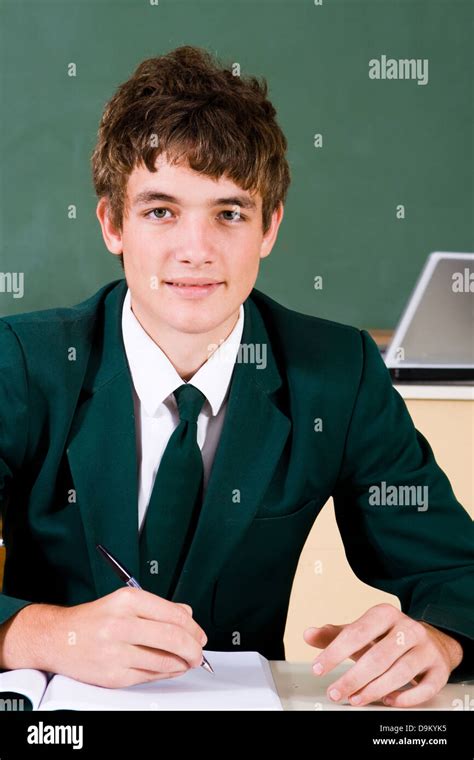 cute high school boy in classroom Stock Photo - Alamy