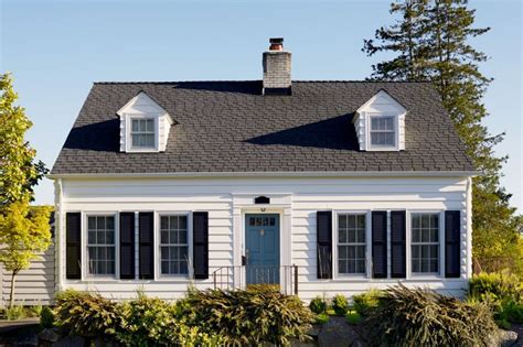 White Cape Cod Traditional White House with Black Shutters and Blue ...