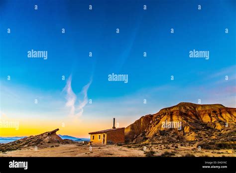 Sunrise over a small house at Bardenas Reales Stock Photo - Alamy