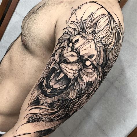 a man with a lion tattoo on his arm