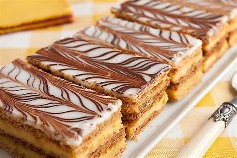 Mille-feuille is a three layers of French pastry dipped in vanilla cream.