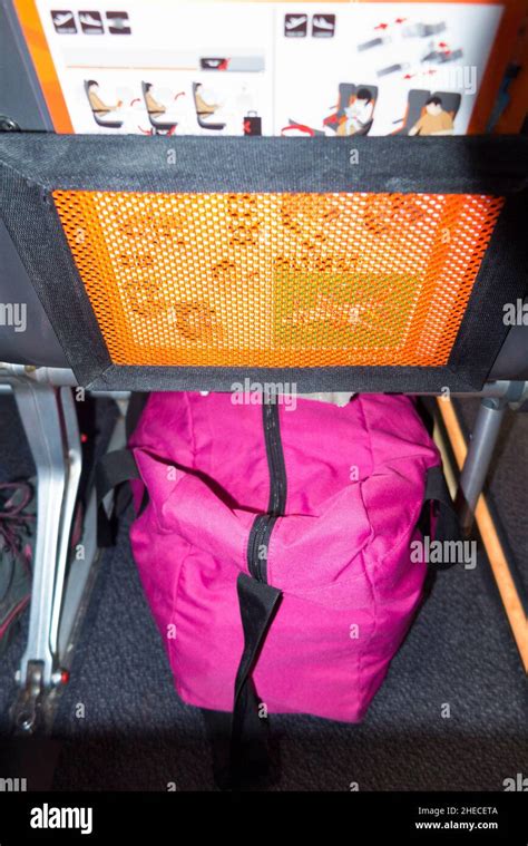 Bags under seat plane hi-res stock photography and images - Alamy