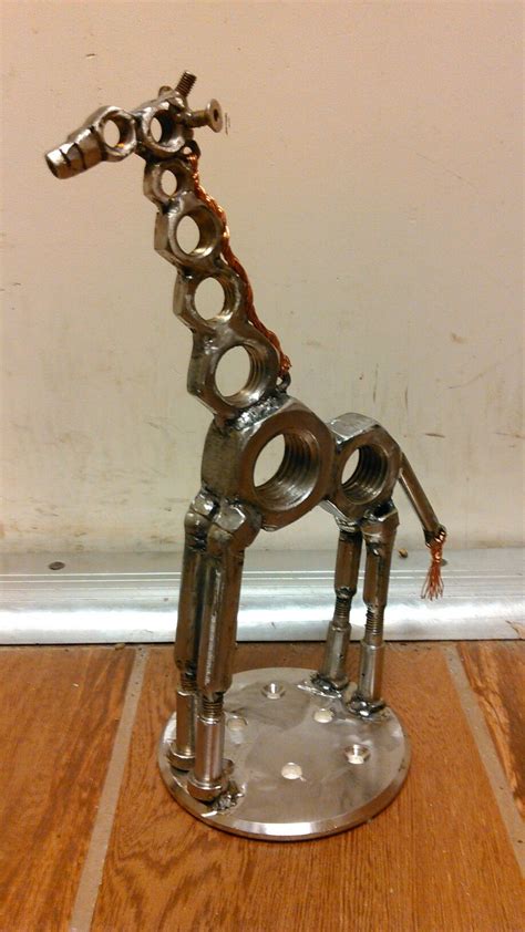 Scrap metal giraffe | Scrap metal art, Recycled metal art, Metal art