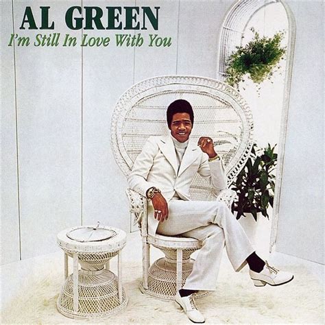 Al Green in a white suit on a white chair with a white wall. He's in love with you and also with ...