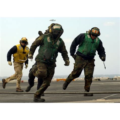 LAMINATED POSTER Crew members aboard the aircraft carrier USS Theodore ...