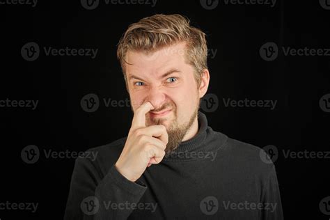 Funny bearded man picking his nose, black background 13405612 Stock ...