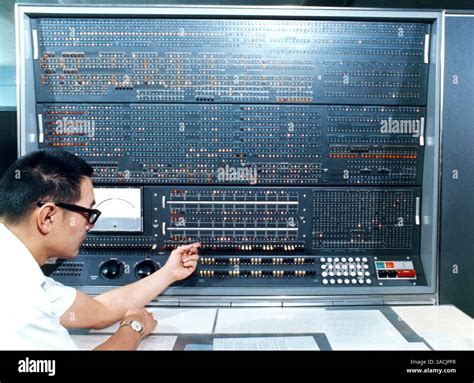 IBM 7030 computer. Operator at the console of an IBM 7030 computer ...