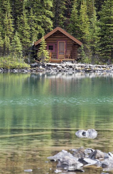 Wooden Cabin Along A Lake Shore Photograph by Michael Interisano - Pixels