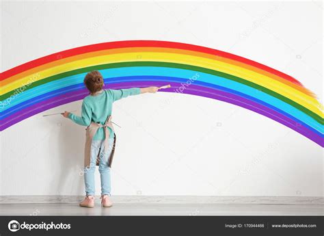 Little boy painting rainbow Stock Photo by ©belchonock 170944466