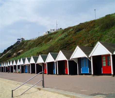 The beach huts on the Bournemouth strand. I love them so! | Bournemouth beach, Beach hut ...