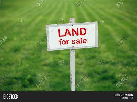 Land Sale Sign Against Image & Photo (Free Trial) | Bigstock