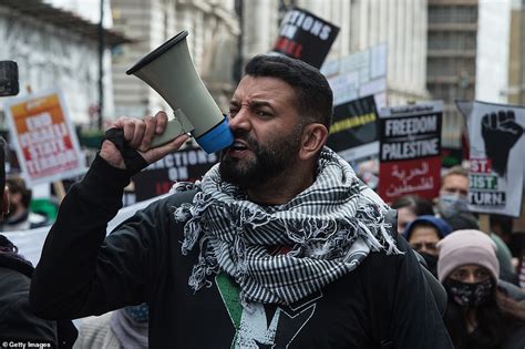 Pro-Palestine protesters in London wave signs saying 'Stop doing what ...