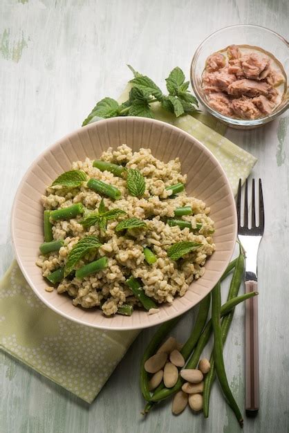 Premium Photo | Cold rice salad with tuna greenbeans almond and mint