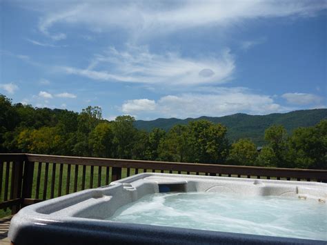 Hot tub view River Log cabin rentals – Canoe, Kayak, Tubing, Camp the Shenandoah River in Luray ...