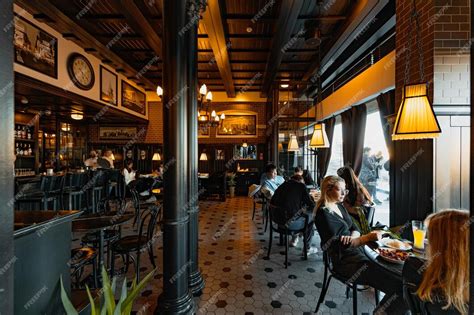 Premium Photo | Vintage style restaurant with columns and resting guests