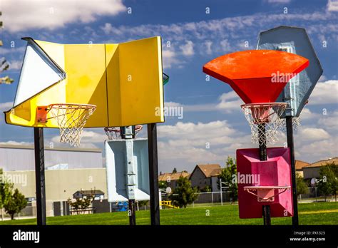 Various Height Modern Basketball Hoops At Children's Playground Stock Photo - Alamy