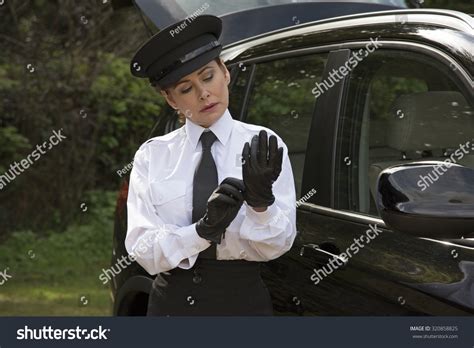 Woman Chauffeur Putting On Her Uniform Stock Photo 320858825 | Shutterstock