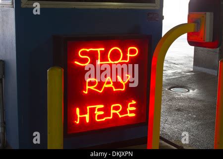 pay here neon sign Stock Photo - Alamy