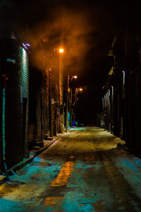 Empty street between buildings during night time, HD phone wallpaper ...