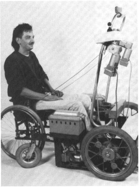 Wheelchair in pOSItiOn between the wheels of the stand up device ...