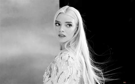 Black and white captivating photo of beautiful young actress Anna Taylor Joy with long blonde ...