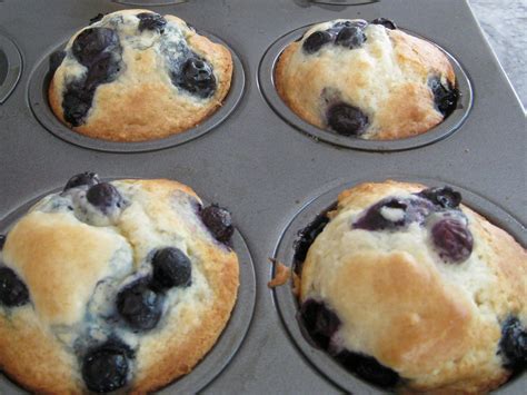 blueberry muffins are in the pan and ready to be baked into the oven