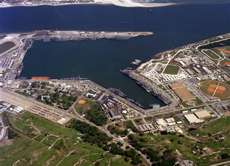 An aerial view of the Mayport Naval Station with various U.S. Navy ships moored at the piers. To ...