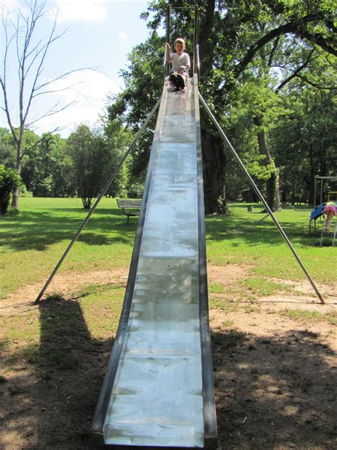 Reminds me of the big slide at Harmon Park that had no trees for shade. Talk about burning your ...