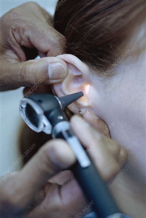 Otoscopy examination - Stock Image - M872/0420 - Science Photo Library