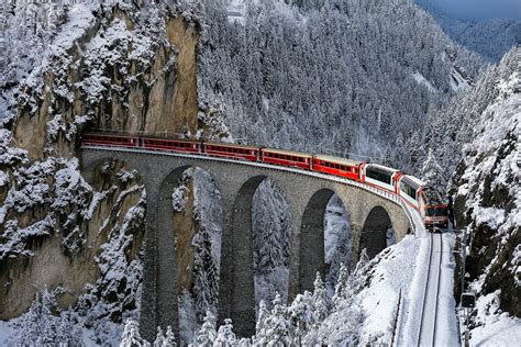 train railway bridge winter snow trees forest mountain tunnel ...