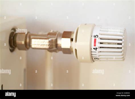 Thermostat at heating elements Stock Photo - Alamy