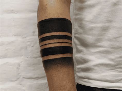 Black Line Tattoo Meaning & Symbolism (Mourning)