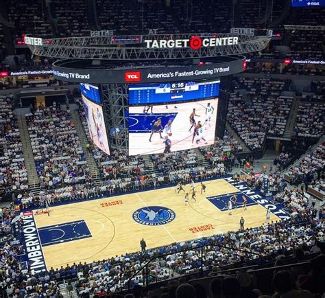 a basketball game is being played on the big screen in an arena with ...